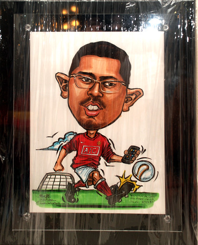 Manchester United soccer caricature with iPhone for People's Association - black acryl;ic frame backing