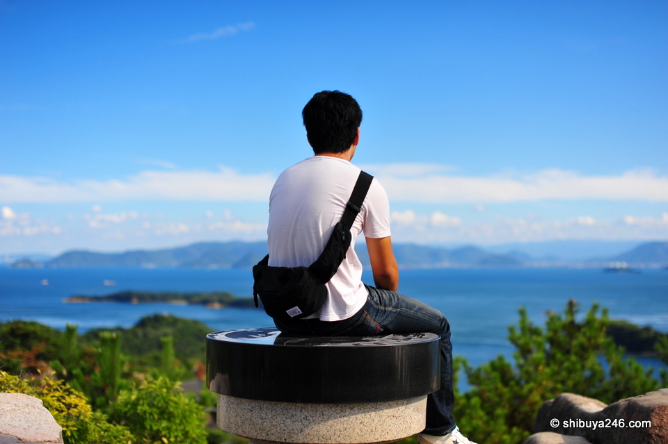 The view was magnificent from the top of Washuzan looking out over the Seto Ohashi Bridges. This guy had the best spot perched on the very top. Seems like he was contemplating something as he looked out.