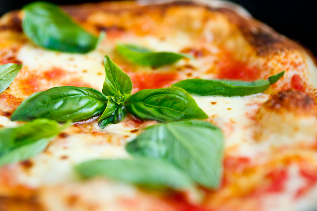 A traditional tomato, basil and mozzarella pizza. Recipe: norecipes.com/2010/09/26/pizza-margherita-recipe/