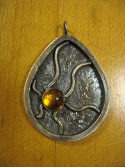 Abstract ammonite with amber