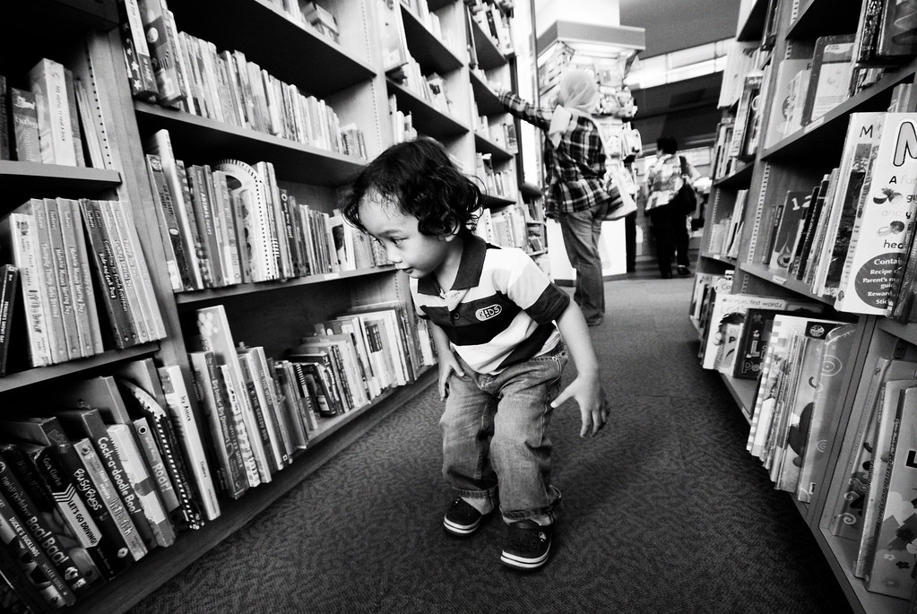 Curious Boy Looking for Books