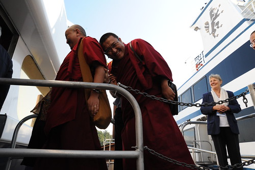 Changling Rinpoche hiding and laughing behind a fellow monk, while boarding the cruise ship on the gangplank, Vancouver BC Harbor, Lotus Speech Canada by Wonderlane