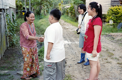 Shake hand with old Kelabit woman