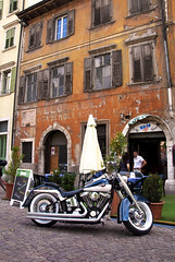Trento storefront with motorcycle