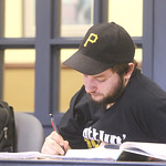 A student taking notes in class.
