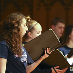 Student singing in choir.