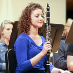 Student sitting with her clarinet.