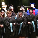 Graduates pose in Orr Auditorium