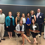 Faculty and alumni pose at the Professional Networking Symposium