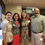 Student poses with professors at the Professional Networking Symposium