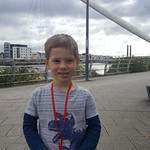 George and his medal for finishing his first full parkrun