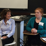 An alumna speaking at a Professional Networking Symposium