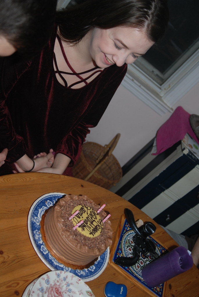 : Ksenia admiring her birthday cake