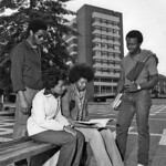 DH Hill rises behind students studying in the late '70s.