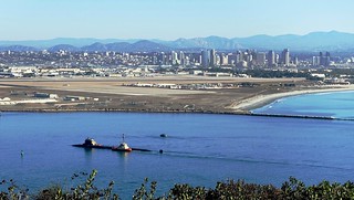 Being escorted into San Diego Harbor is the USS Jimmy Carter, the third and last Seawolf-class nuclear submarine in the US Navy.