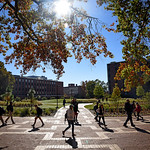 学生 walk to class on North Campus at the Brickyard, near the space where Harrelson Hall used to be in fall 2017.