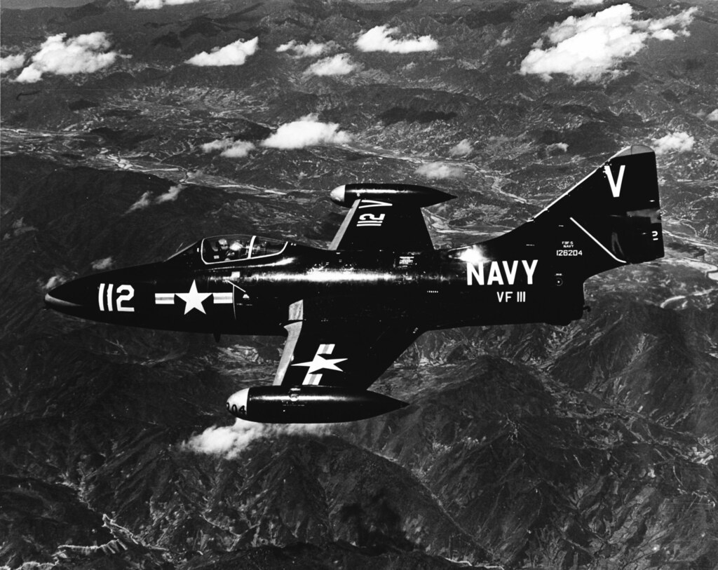 : A U.S. Navy Grumman F9F-5 Panther jet fighter (BuNo 126204) of VF-111 over Korea in June 1953