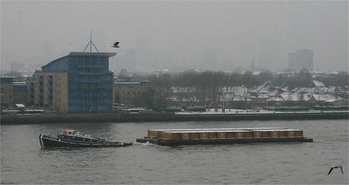 Snow covered barge in London