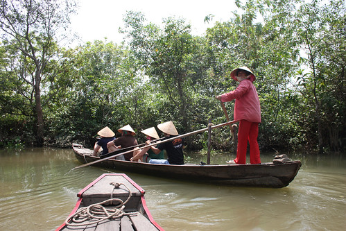Being rowed down a Mekong Tributary