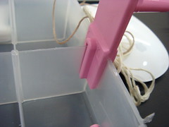 Insert the winder on the ONE side of the case WITH the DIVIDER. 