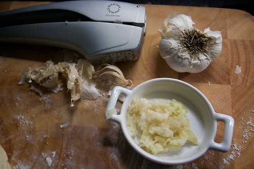 pressing garlic