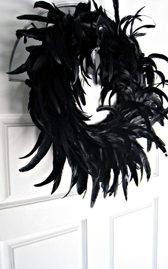 black feather wreath on the front door+halloween decor+holiday decorating