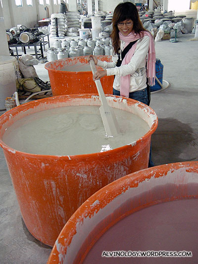 Stirring the glaze used to colour the ceramic