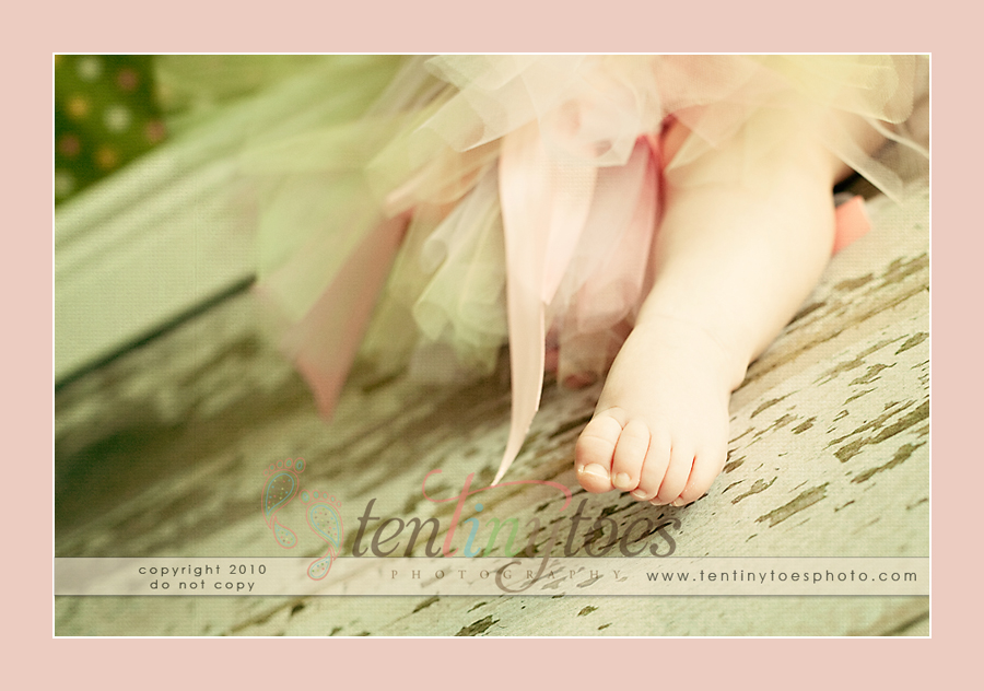 Cute little baby toes with tutu