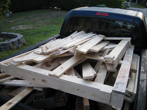 pine shipping crate wood pile in back of truck
