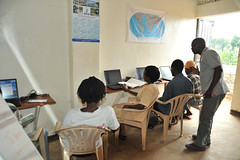 10b. Young adults learning computer skills at Suubi