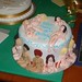 18th birthday round cake with naked women made out of icing as decoration.
