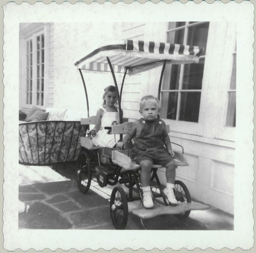 Two children on a wagon