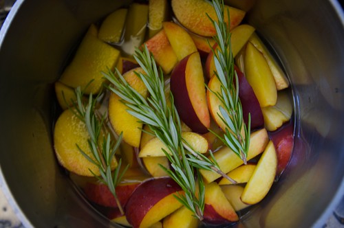 adding the peaches & rosemary to the syrup