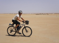 8a. Cycling on the tidal flat while vehicles stick to the dunes. The rim of the rear split and so I had to take the load off to nurse it to the finish