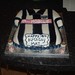 Birthday cake in the shape of a West Bromwich Albion football shirt.