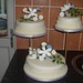 3 tiered wedding cake with Me to You bride and groom and a selection of flowers.