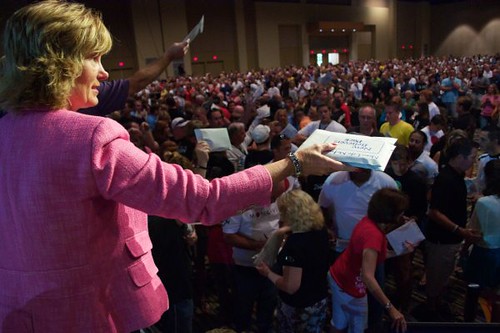 Cheryl Handing Out Packets at Altar Call