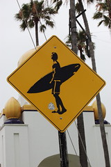 July 19: Surfer crossing
