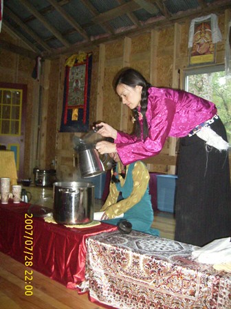 Tibetan women serving refreshments