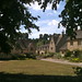 View of Alms Cottages at the entrance road to Bibury Court Hotel