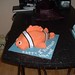 Custom birthday cake in the shape of Nemo from Finding Nemo.