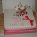 Square 65th birthday cake with handmade flower decoration.