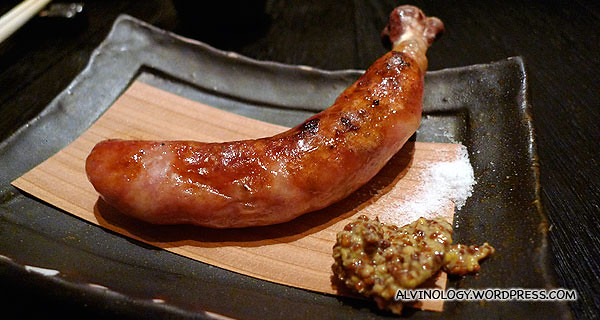 Grilled minced pork sausage served with a little bone tucked like a chicken drumstick