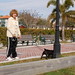 Pit Stop_0763<br /><span style="font-size:0.8em;">The doggie's mom-in-law taking him out for a stroll. Though she looked very New York she was snowbirding down in Cocoa Florida.</span>