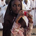 Sudanese girl photographing tourists