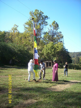 Louanne & crew raising flag