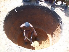 A local man helps to dig