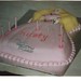 Birthday cake in the shape of a princess with hand decorated features.
