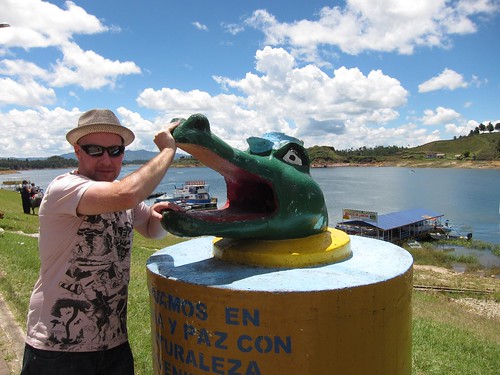 Testing my strength against Guatape's viscious alligator garbage can!