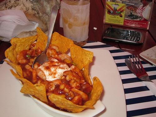 Mexican ceviche with shrimp, avocado, corn, and sour cream served in BBQ sauce with tortilla chips.